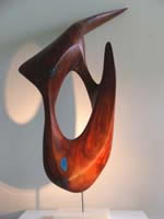 Abstract sculpture carved in red cedar entitled wetlands - kakadu'